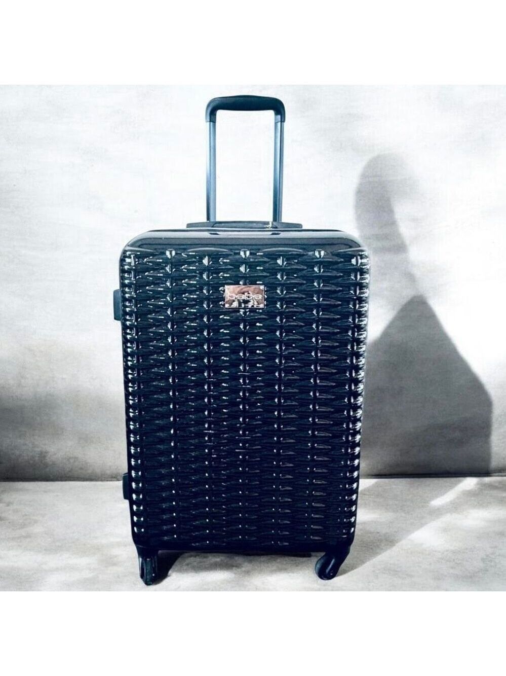 NWT Bebe Gorgeous 25” Lydia Black woven basketweave spinner hard shell Luggage